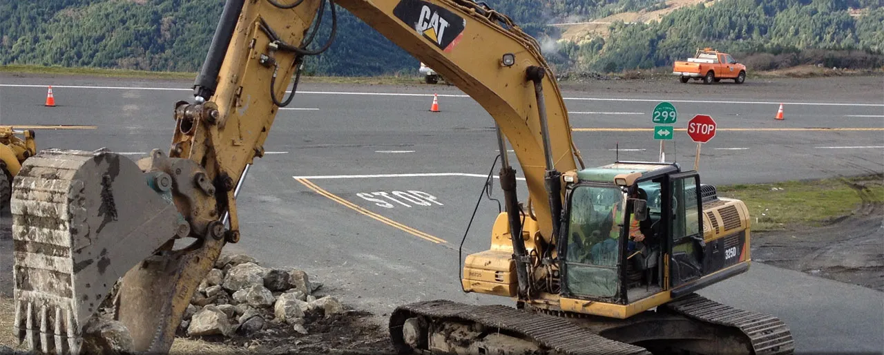 A G.R. Sundberg excavator working the shoulder of Highway 299 in Humboldt County
