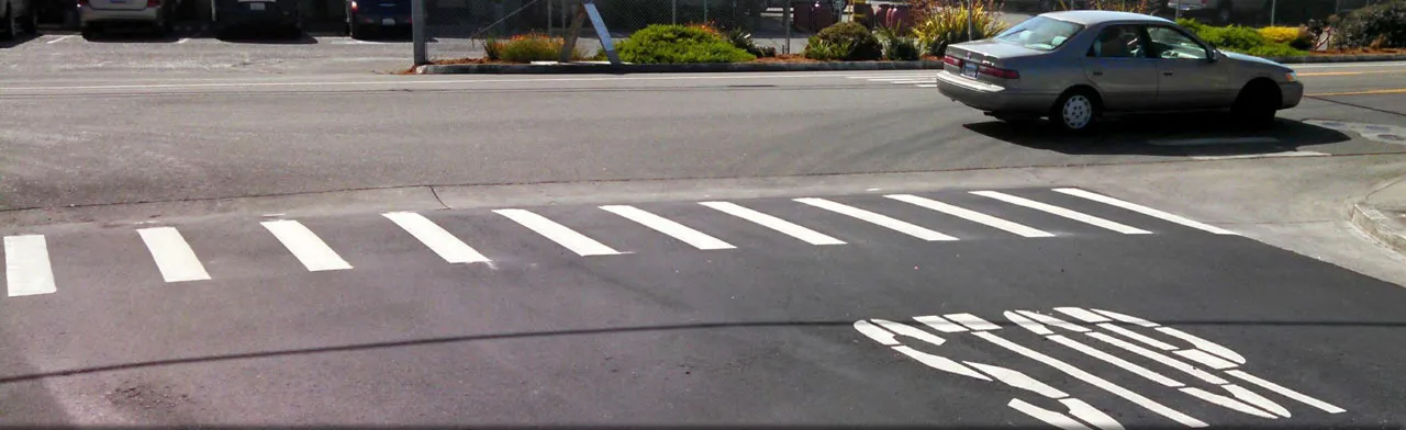 Fresh thermoplastic striping applied to a roadway